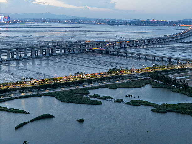 istock A serene evening view of an expansive bridge over calm waters. 2226858319