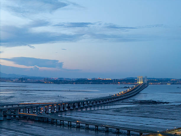 istock A serene evening view of an expansive bridge over calm waters. 2226858335