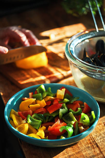 Preparing Rigattone Pasta with Blue Mussels and Mixed Peppers in Domestic Kitchen