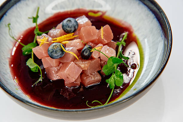 istock A Gourmet Array of Cubed Ingredients Dressed with Fresh Herbs and Bright Berries in Vibrant Sauce Served in a Stylish Bowl 2226868603