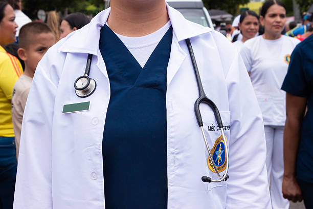 Neiva, Huila, Colombia - July 20, 2025 - An unrecognizable female doctor wearing a gown and stethoscope at a military parade celebrating Independence Day