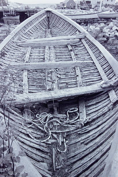 A timeless black-and-white photograph of the village of Peggy’s Cove, Nova Scotia, captured on print film in 2001. Weathered fishing shacks, quiet docks, and rugged coastal textures evoke a nostalgic glimpse into East Coast life, rendered in rich monochrome tones.