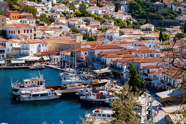 Overlooking the harbor and town of Hydra, Greece. Boats can be seen at the dock.