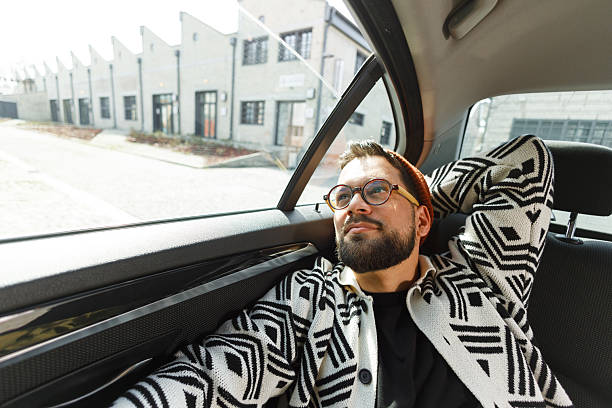 istock Stylish Man Relaxing in Car Backseat 2226877251