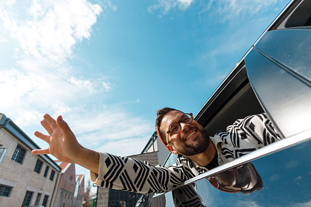 istock Excited Man Celebrating from Car Window 2226877256