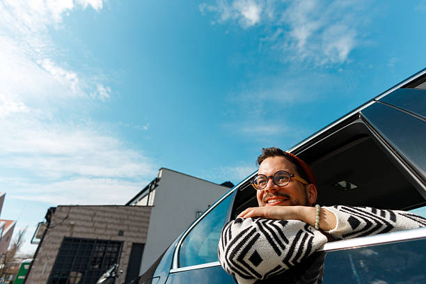 istock Excited Man Celebrating from Car Window 2226877292
