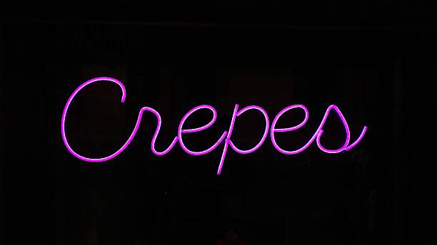 istock crepes - reads the violet-colored glowing neon sign 2226877387