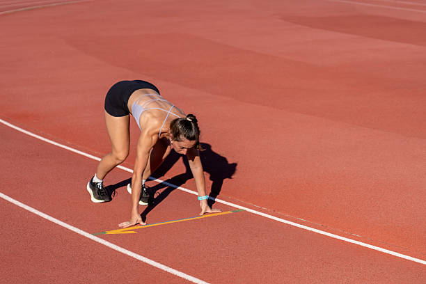 istock Female athlete preparing for a race on a running track 2226881993