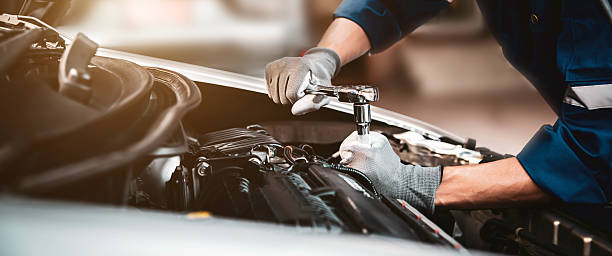 Car care maintenance and servicing, Close-up hand technician auto mechanic using the wrench to repairing change spare part car engine problem and car insurance service support.