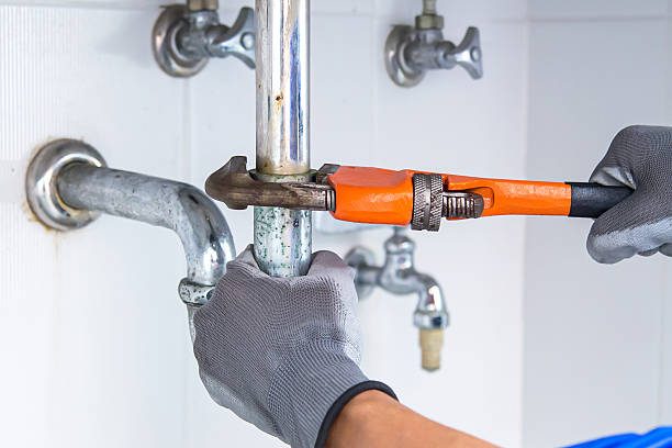 istock Technician plumber using a wrench to repair a water pipe under the sink. Concept of maintenance, fix water plumbing leaks, replace the kitchen sink drain, cleaning clogged pipes is dirty or rusty. 2226885368