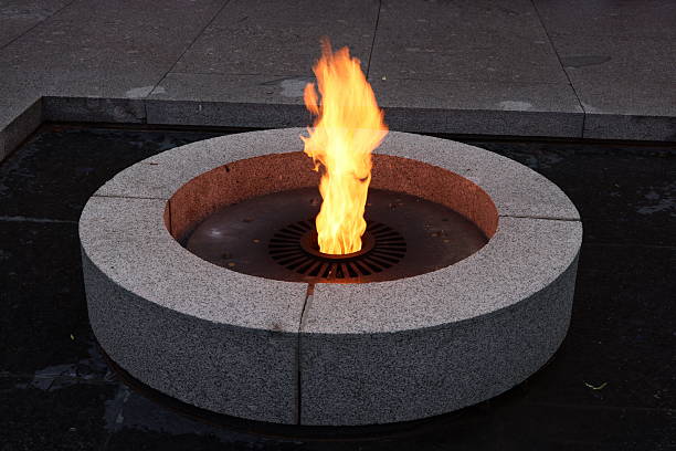 istock An Eternal Flame beautifully placed in a Stone Basin, set against a serene backdrop at Dusk 2226892831