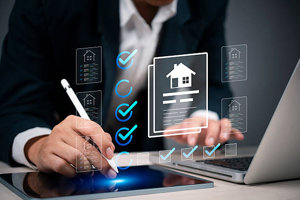 istock Hand holding stylus, interacting with digital house forms and checklist on tablet. Real estate investment, online property search. Smart home solutions, housing market. 2226893821
