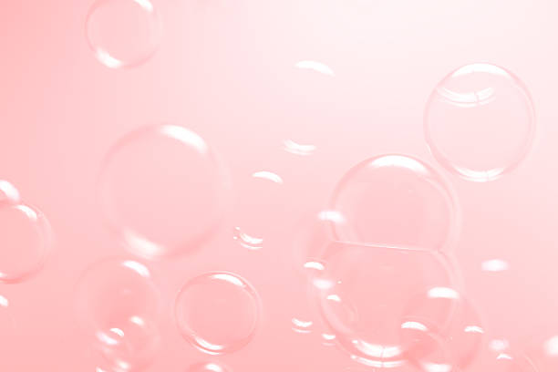istock Beautiful Clear Pink Soap Bubbles Floating in The Air. Celebration Festive Backdrop. Freshness Soap Suds Bubbles Water. Pink and White Gradient Textured. 2226894709