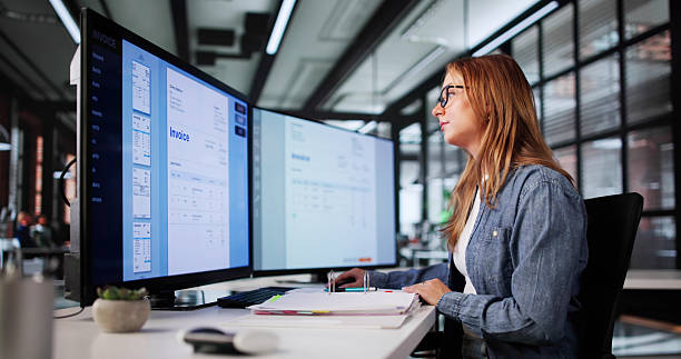 istock Young Woman Managing Payroll, Auditing Medical Bills 2226897009