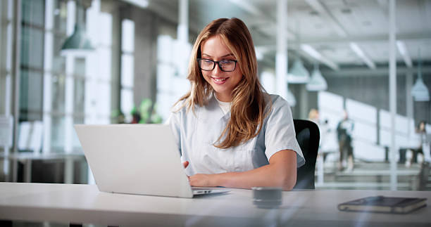 istock Smiling Female Doctor And Nurse Chat Online 2226897021