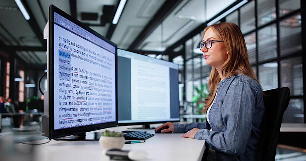istock Young Woman Proofreading Book Review Article On Computer Screen 2226897040