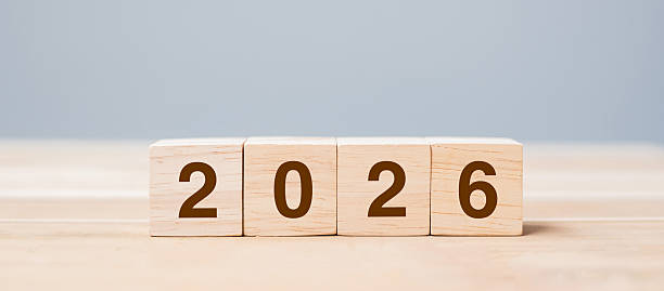 istock wooden cube block with 2026 text on table background. Resolution, plan, review, goal, start and New Year holiday concepts 2226898072