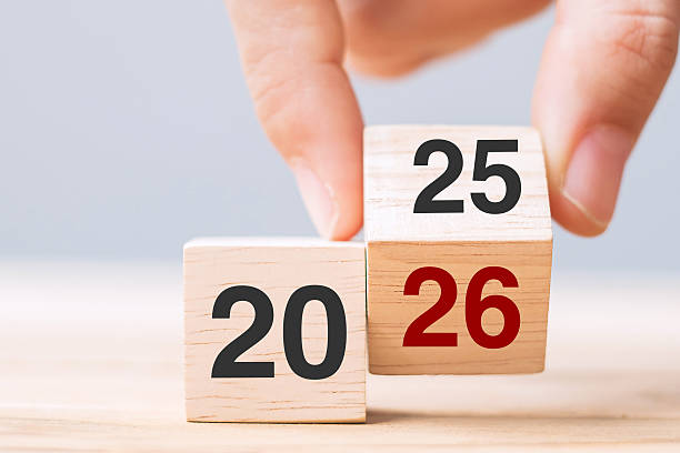 istock hand flip cube block 2025 to 2026 text on table. Resolution, review, strategy, end year, goal, business and New Year holiday concepts 2226898113