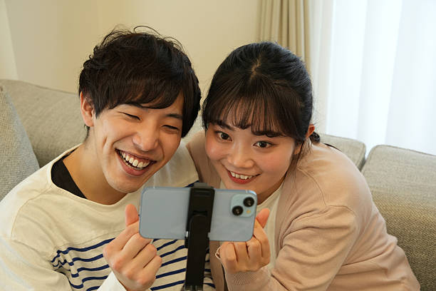 istock Couple taking a selfie on the sofa 2226904758
