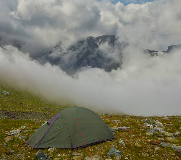 istock small touristic tent stay in mountain in dense mist and clouds 2226906506