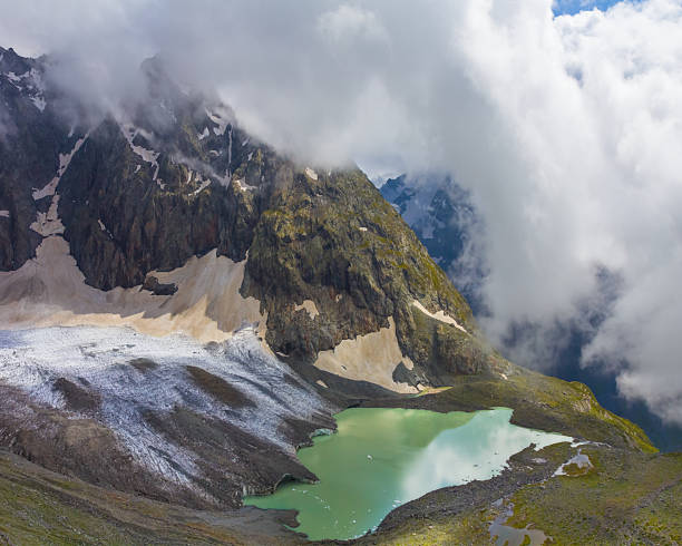 istock snowbound mountain ridge in mist and dense clouds, mountain travel scene 2226906533