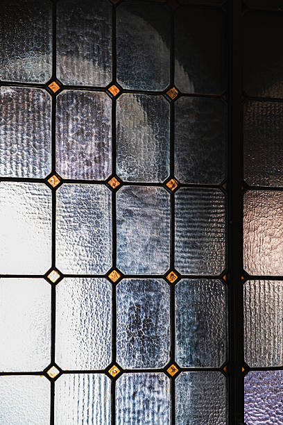 istock Light passing through an ornamental glass pane in window 2226907320