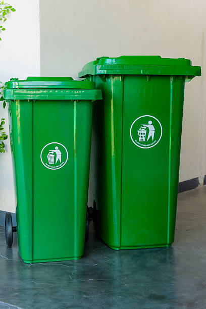 istock Two plastic mobile trash bins of two different sizes placed at the hallway. 2226907709