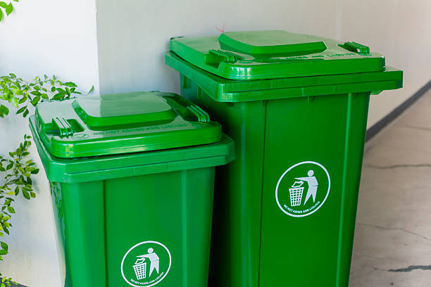 istock Two plastic mobile trash bins of two different sizes placed at the hallway. 2226907710