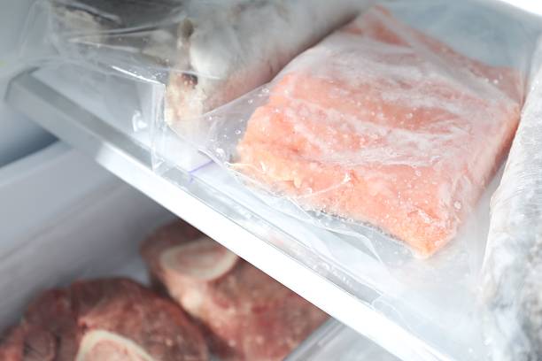 istock Different frozen meat and fish products on refrigerator shelf, closeup 2226910819