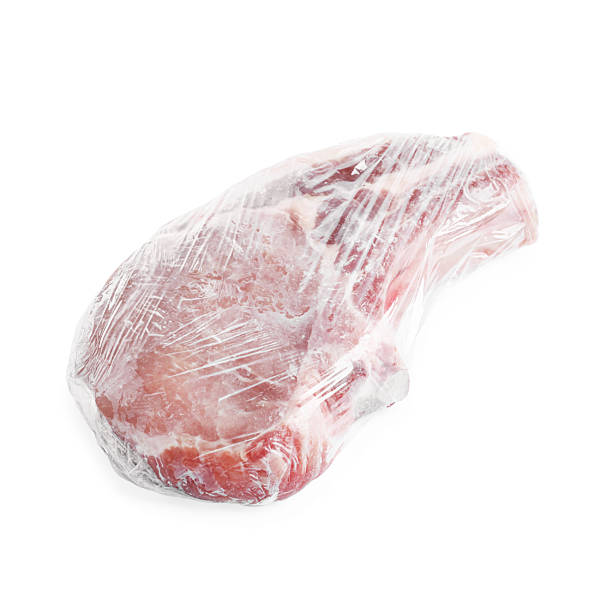 istock One frozen pork steak in plastic wrap isolated on white 2226910909