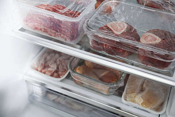 istock Different frozen meat products in fridge, closeup 2226910993