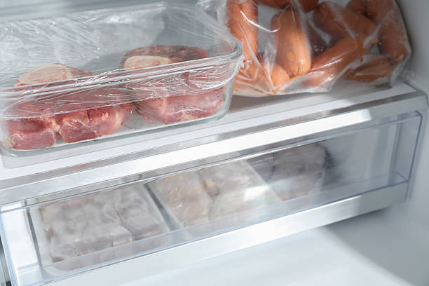 istock Different frozen meat products in fridge, closeup 2226910994