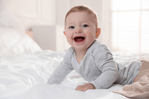 istock Cute little baby on bed at home 2226911457