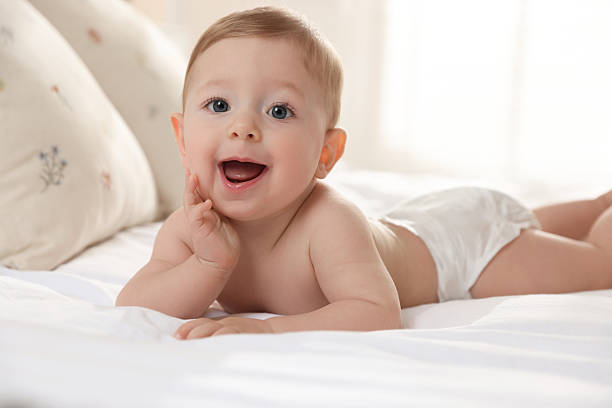 istock Cute little baby on bed at home 2226911504