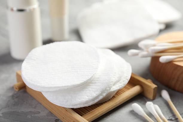 istock Clean cotton pads and swabs on grey table, closeup 2226911603