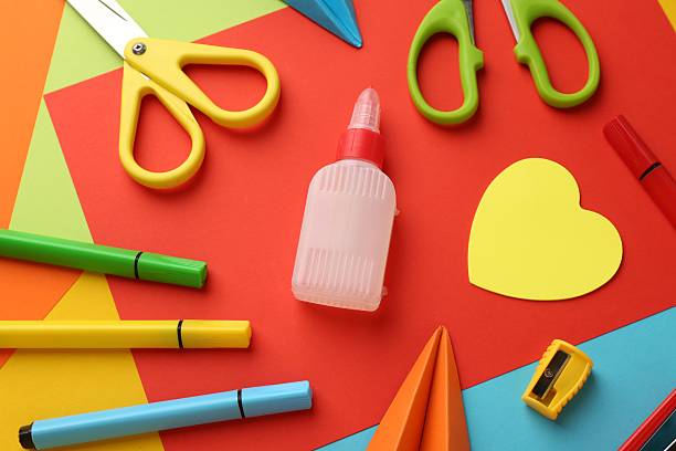 istock Flat lay composition with glue, scissors and other stationery on color background 2226911702