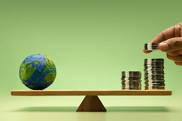 istock Global investment concept with Coin money Stack and Globe balanced on a scale, representing Global financial and Uncertainty Economic 2226911945