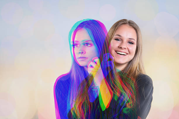 Happy and unhappy moments intertwined. Two separate moods of being Happy or Unhappy with herself. Multiple Exposure. Isolated on light yellow background. Studio shot.