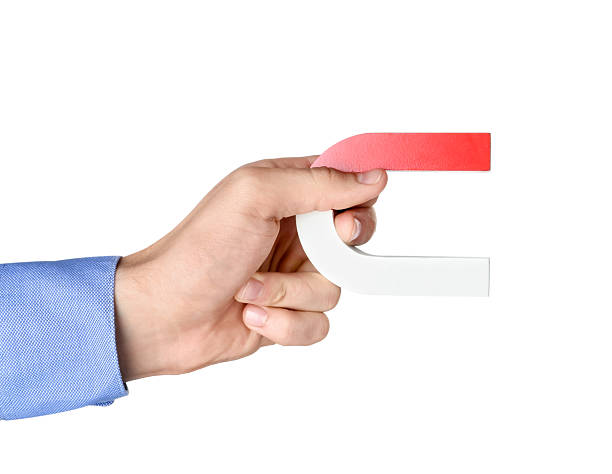 istock Man with horseshoe magnet on white background, closeup 2226912900