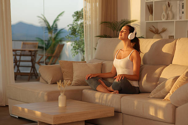 istock Yogi doing meditation with headphone at home 2226912952