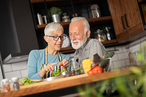 istock Mature couple cooking lunch together 2226913419