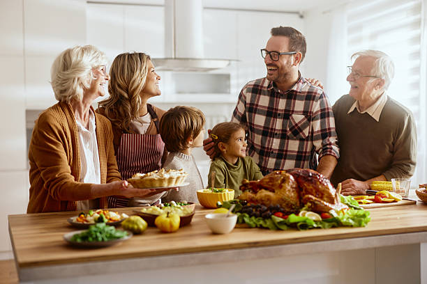 istock Happy multi-generation family talking during Thanksgiving in the kitchen. 2226913472