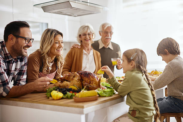 istock Happy multi-generation family enjoying in Thanksgiving at the kitchen. 2226914285