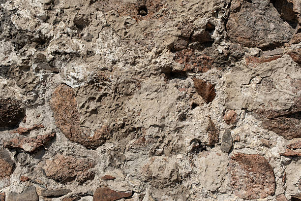 istock Old rustic stone wall showcasing varied textures in natural light during afternoon hours 2226915969