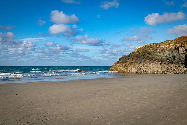 istock playa de cathedrales Beach With Clear Sky and Rolling Waves Near Rocky Cliff 2226920163