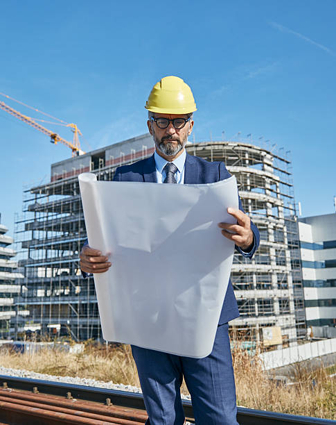 istock senior businessman architect helmet construction site building architecture tablet computer protective workwear blueprint plan 2226920890