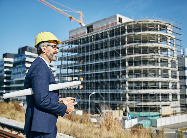 istock senior businessman architect helmet construction site building architecture tablet computer protective workwear blueprint plan 2226921055