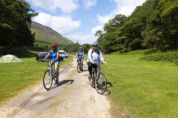 istock Female Friends Riding Bikes Together 2226923067