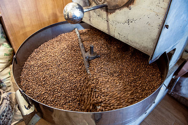 istock Coffee beans are mixed in a roasting machine for even roasting of the beans. 2226923514