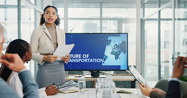 istock Woman, presentation and screen with documents at meeting for future transport infrastructure at office. Person, speaker and staff in boardroom with problem solving for eco friendly vehicle at agency 2226926899